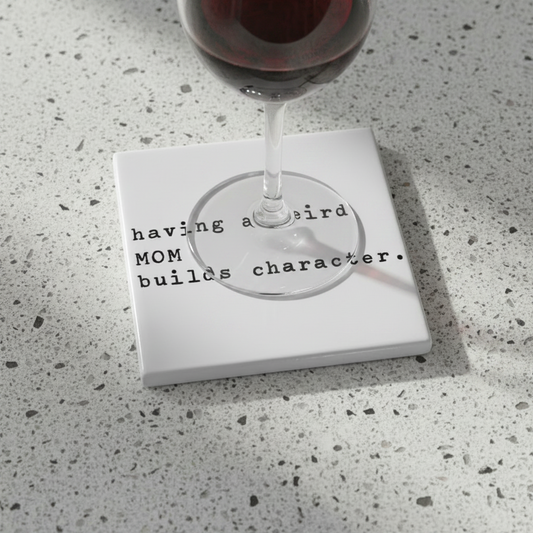 white coaster with black text on a white background